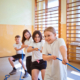 Four kids pulling a rope together
